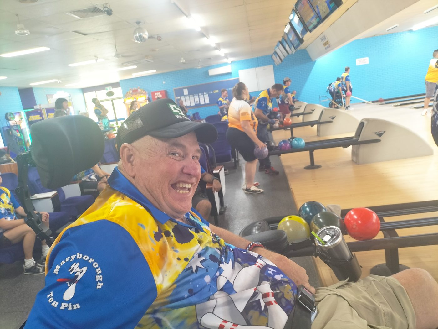 Client smiling during a bowling activity